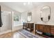 Bright bathroom with double vanities, tiled shower, and soaking tub under a window at 741 N Cholla St, Chandler, AZ 85224