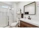Bright bathroom featuring a glass shower, modern vanity, and stylish decorative elements at 741 N Cholla St, Chandler, AZ 85224