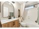 Updated bathroom with modern vanity, white countertop, bathtub, and classic fixtures at 741 N Cholla St, Chandler, AZ 85224