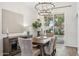 Dining area with a modern chandelier, stylish buffet, and a view of the backyard at 741 N Cholla St, Chandler, AZ 85224