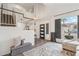 Bright foyer featuring a contemporary front door, staircase, and a stylish gray ottoman at 741 N Cholla St, Chandler, AZ 85224