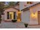 Inviting home exterior featuring a charming facade, desert landscaping, and warm lighting at 741 N Cholla St, Chandler, AZ 85224