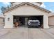 Spacious two-car garage with a white truck, motorcycle, and plenty of extra storage space at 741 N Cholla St, Chandler, AZ 85224