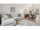 Comfortable living room showcasing a cozy sectional, stylish decor, and a modern light fixture at 741 N Cholla St, Chandler, AZ 85224