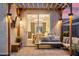 Outdoor patio area featuring an outdoor sofa, lighting, television, and a stylish swing at dusk at 741 N Cholla St, Chandler, AZ 85224