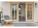 Inviting outdoor patio with comfortable seating, neutral rug, and view into the cozy living room at 741 N Cholla St, Chandler, AZ 85224