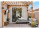 Outdoor patio area featuring an outdoor sofa, lighting, television, and a stylish swing at 741 N Cholla St, Chandler, AZ 85224