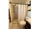 Updated bathroom featuring a tiled shower, modern fixtures, and stylish tile flooring at 817 N 95Th Pl, Mesa, AZ 85207