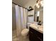 Bright bathroom with a shower, updated vanity, and contemporary design elements at 817 N 95Th Pl, Mesa, AZ 85207