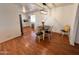 Bright dining area showcasing hardwood floors, modern lighting, and open-concept design at 817 N 95Th Pl, Mesa, AZ 85207