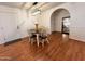 Cozy dining room with hardwood floors and stylish lighting fixture above the dining table at 817 N 95Th Pl, Mesa, AZ 85207