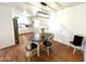 Bright dining area features an oval table with seating for four and modern lighting fixture at 817 N 95Th Pl, Mesa, AZ 85207