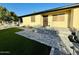 Charming single-story home showcasing a well-maintained yard and inviting front entrance at 817 N 95Th Pl, Mesa, AZ 85207
