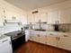 Modern kitchen with updated appliances, sleek countertops, and ample cabinet space at 817 N 95Th Pl, Mesa, AZ 85207