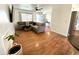 Comfortable living room with hardwood floors, a sectional sofa, and lots of natural light at 817 N 95Th Pl, Mesa, AZ 85207
