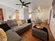 Spacious living room showcasing hardwood floors, modern decor, and an open floor plan at 817 N 95Th Pl, Mesa, AZ 85207