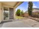 Backyard featuring a covered patio, green lawn, and tasteful landscaping at 863 E Waterview Pl, Chandler, AZ 85249