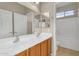 Bathroom with a double sink vanity, large mirror and separate shower at 863 E Waterview Pl, Chandler, AZ 85249