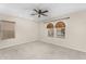 Inviting bedroom with fan and large windows offering abundant natural light and outdoor views at 863 E Waterview Pl, Chandler, AZ 85249
