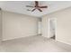 Spacious bedroom with plush carpet and ceiling fan, perfect for relaxation and restful nights at 863 E Waterview Pl, Chandler, AZ 85249