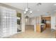 Bright dining area and kitchen featuring tile floors and sliding glass doors at 863 E Waterview Pl, Chandler, AZ 85249
