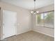 Bright dining area features tile flooring, natural light, and a modern chandelier, ideal for Gathering meals at 863 E Waterview Pl, Chandler, AZ 85249