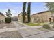 Charming home featuring a tile roof, desert landscaping, and a spacious driveway leading to a two-car garage at 863 E Waterview Pl, Chandler, AZ 85249
