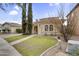 Inviting home showcasing desert landscaping, a red tile roof, and an arched entryway, offering curb appeal at 863 E Waterview Pl, Chandler, AZ 85249