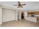 Open kitchen featuring tile flooring, black appliances, wooden cabinets and an island with a sink at 863 E Waterview Pl, Chandler, AZ 85249