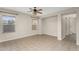 An open living room with tile floors, ceiling fan, and stairway access at 863 E Waterview Pl, Chandler, AZ 85249