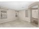 Open-concept living area features carpeted floors, multiple windows, and an arched entryway, creating a welcoming space at 863 E Waterview Pl, Chandler, AZ 85249