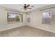 Bright room with tile flooring, a ceiling fan, and a window view at 863 E Waterview Pl, Chandler, AZ 85249