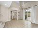 Bright, open-concept living room boasts tile floors, a decorative chandelier, and a sliding glass door for natural light at 863 E Waterview Pl, Chandler, AZ 85249