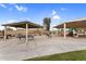 Shaded picnic area with multiple tables, benches, and barbeque grills, perfect for outdoor gatherings and community events at 863 E Waterview Pl, Chandler, AZ 85249
