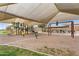 Community playground with swings, slides, and covered seating areas, ideal for Gathering fun and outdoor recreation at 863 E Waterview Pl, Chandler, AZ 85249
