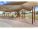 Community playground featuring swings, slides, and shaded areas for children to play and enjoy outdoor activities at 863 E Waterview Pl, Chandler, AZ 85249