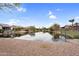 Waterfront homes nestled along a calm pond, offering serene views and tranquil living at 863 E Waterview Pl, Chandler, AZ 85249