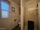 Bright bathroom featuring a glass-enclosed shower, toilet, vanity, and window at 8700 E University Dr # 649, Mesa, AZ 85207