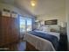Cozy bedroom with natural light, a plush bed, and ample closet space at 8700 E University Dr # 649, Mesa, AZ 85207