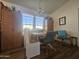 An inviting dining area with ample natural light and adjacent built-in cabinets and bench seating at 8700 E University Dr # 649, Mesa, AZ 85207