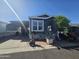 Charming home featuring a covered carport, well-manicured landscaping, and ample outdoor space at 8700 E University Dr # 649, Mesa, AZ 85207