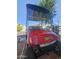 EZGO golf cart in front of the home with brick landscaping at 8700 E University Dr # 649, Mesa, AZ 85207