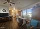 An open floor plan featuring a living room and a kitchen with updated appliances and wooden cabinets at 8700 E University Dr # 649, Mesa, AZ 85207