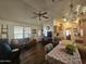 Open-concept living room featuring ample natural light and stylish furnishings at 8700 E University Dr # 649, Mesa, AZ 85207