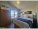 Bright main bedroom with large window, hardwood floors, and ample closet space at 8700 E University Dr # 649, Mesa, AZ 85207
