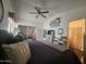 This is the main bedroom featuring a ceiling fan, access to the bathroom and mirrored closet at 8700 E University Dr # 649, Mesa, AZ 85207