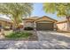 Charming single-Gathering home with a well-maintained front yard and a two-car garage at 9331 W Harmony Ln, Peoria, AZ 85382