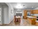 Eat-in kitchen with light wood cabinets, stainless steel appliances, and tile floor at 9331 W Harmony Ln, Peoria, AZ 85382