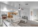 Bright living room featuring an open floor plan, white walls, and large sectional sofa at 9331 W Harmony Ln, Peoria, AZ 85382