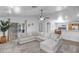 Open-concept living room with lots of natural light, neutral furniture, and easy access to backyard at 9331 W Harmony Ln, Peoria, AZ 85382